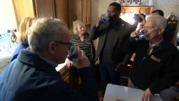 From left, Ohio Gov. Mike DeWine, EPA Administrator Michael Regan and US Rep. Bill Johnson drink tap water from a home they visited in East Palestine, Ohio, on Tuesday, February 21.