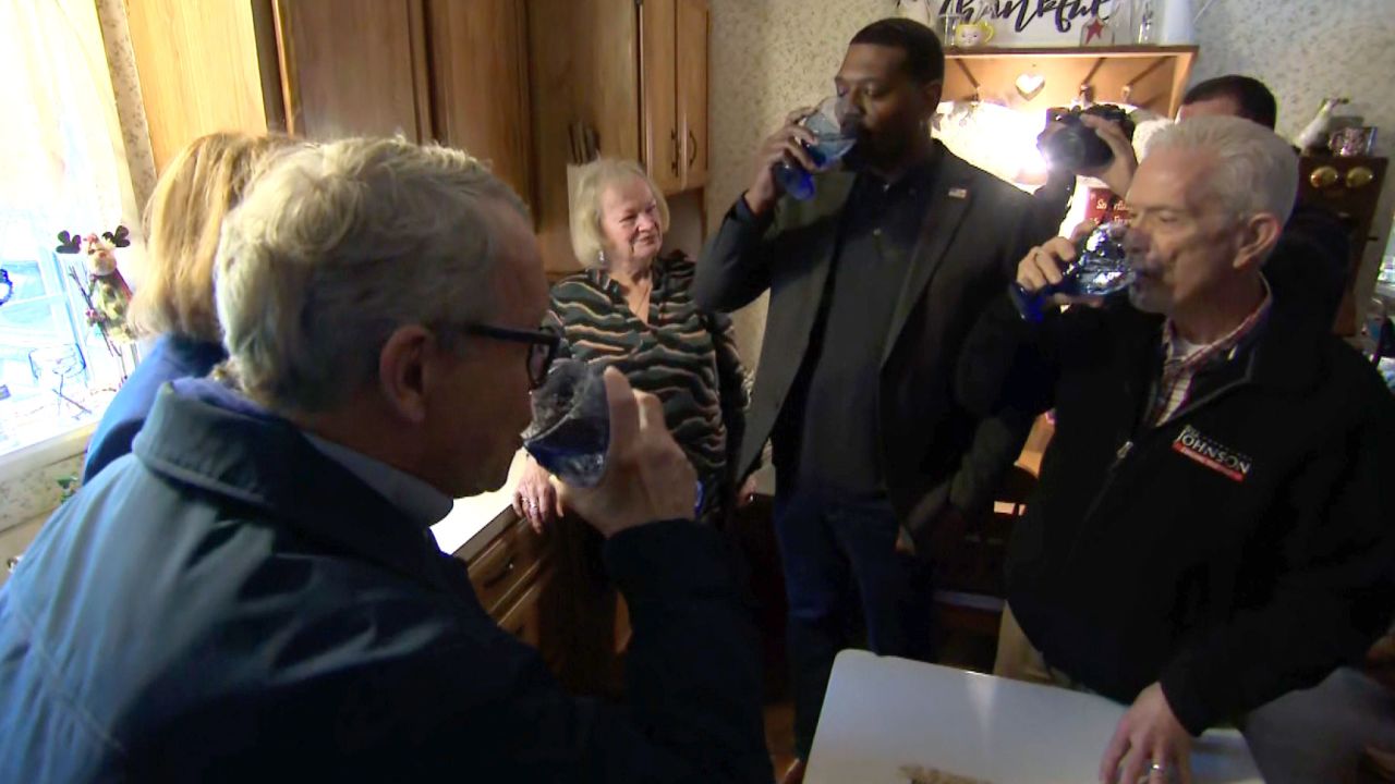 From left, Ohio Gov. Mike DeWine, EPA Administrator Michael Regan and US Rep. Bill Johnson drink tap water poured directly from a faucet Tuesday from a home in East Palestine.