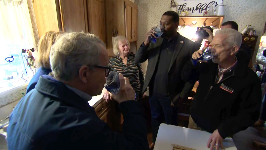 From left, Ohio Gov. Mike DeWine, EPA Administrator Michael Regan and US Rep. Bill Johnson drink tap water poured directly from a faucet Tuesday from a home in East Palestine.