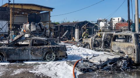 CNN affiliate WSVN video showed several semi-tractors, cars and a structure engulfed in flames. 