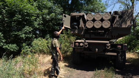 Kuzia, the commander of the unit, shows the rockets on HIMARS vehicle in Eastern Ukraine on July 1, 2022. 