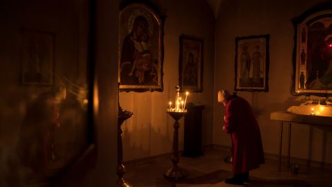 A year after the Russians' brutal occupation, Bucha is rebuilding. But the survivors remain broken 9 A woman prays in a basement crypt of the Church of St. Andrew.