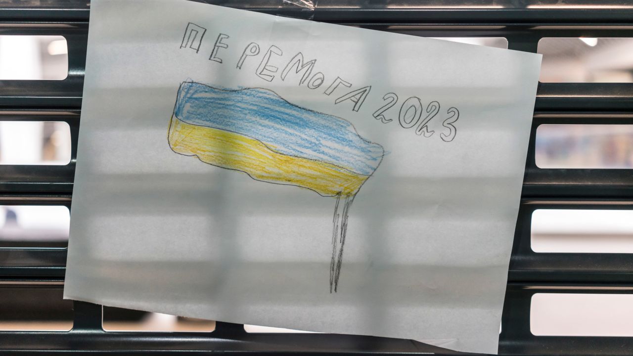 One of Sonya's drawings shows a Ukrainian flag and says "Victory 2023."