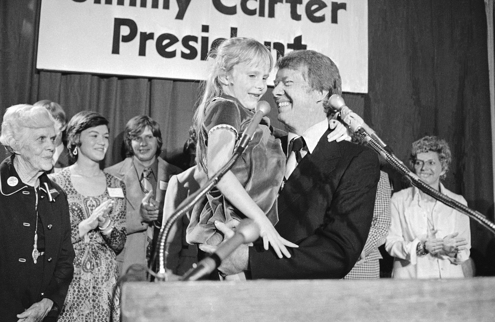 Carter holds his 7-year-old daughter, Amy, in 1974, just after he officially announced that he would be running for president.
