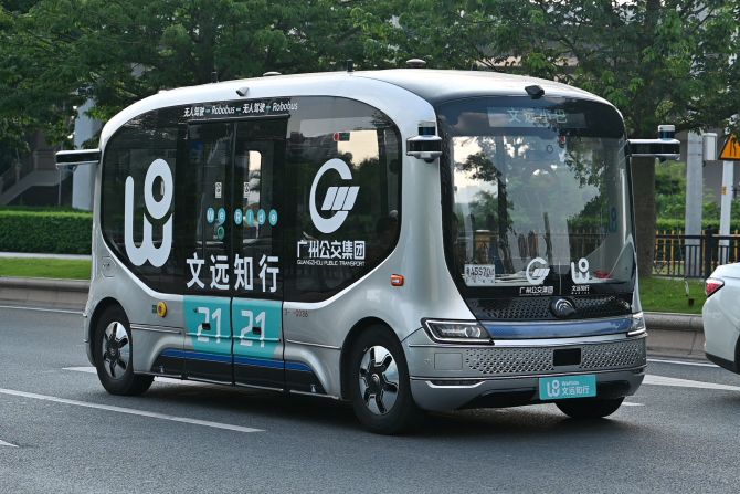 Self-driving electric minibuses (pictured here during a trial run in July 2022) are already available to the public in Guangzhou, China. Created by WeRide, the Robobus -- like the Zoox robotaxi -- has no steering wheel, brake or accelerator.
