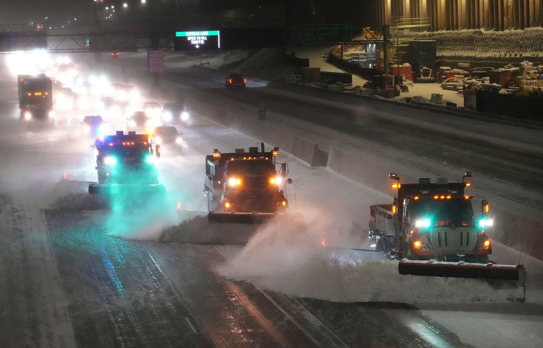 Snow plows clear a highway in Minneapolis on Wednesday, February 22, 2023.