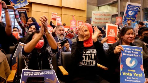 Supporters of a proposal to add caste to Seattle's anti-discrimination laws applaud as the city council votes to pass the ordinance.