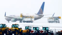 A United Airlines aircraft is de-iced before takeoff during a winter storm at Denver International Airport on February 22, 2023.
