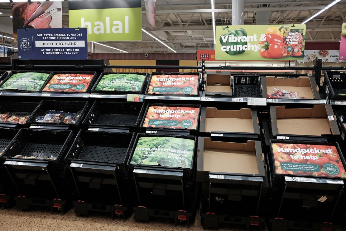 Empty fruit and vegetable shelves at an Asda store in London on February 21, 2023. 