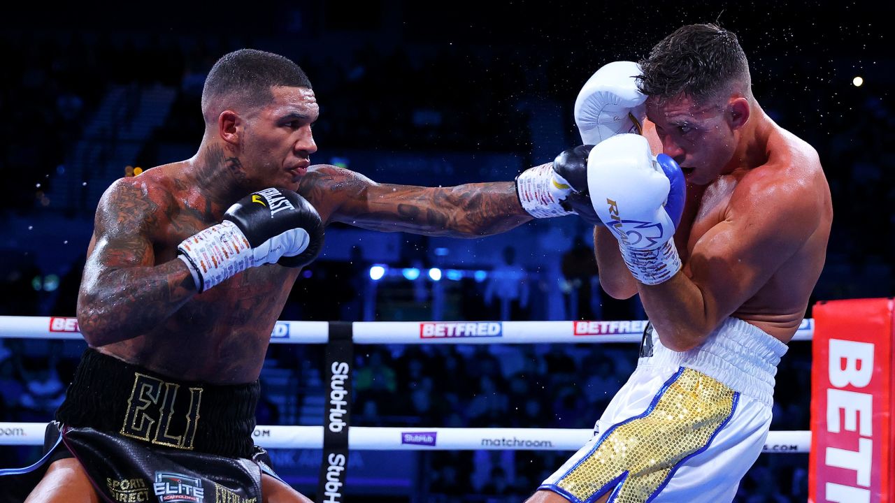 Benn punches Chris Algieri during their WBA Continental welterweight title fight on December 11, 2021.