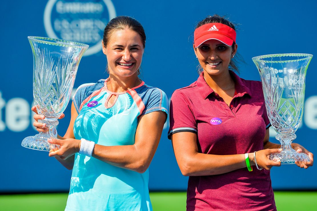 Mirza poses with Monica Niculescu of Romania after defeating Kateryna Bondarenko of the Ukraine and Chia-Jung Chuang of Taipei in the women's doubles final at the Connecticut Open in 2016.
