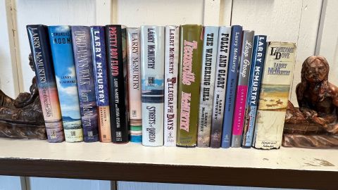 A collection of Larry McMurtry's books sit on a shelf in the Archer Public Library.