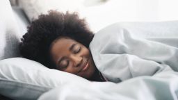 Shot of an attractive young woman sleeping in her bed in the morning at home