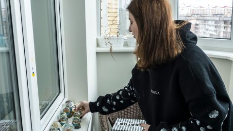 Arieva shows off her collection of snow dome souvenirs picked up during her travels.