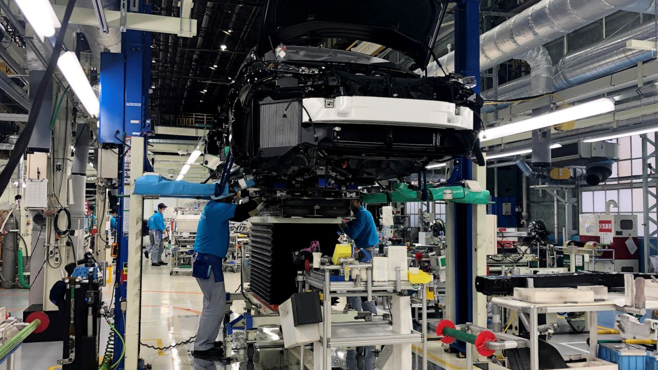 Workers install the fuel cell power system in a Toyota Mirai at its factory in Aichi Prefecture, Japan, on  April 11, 2019.