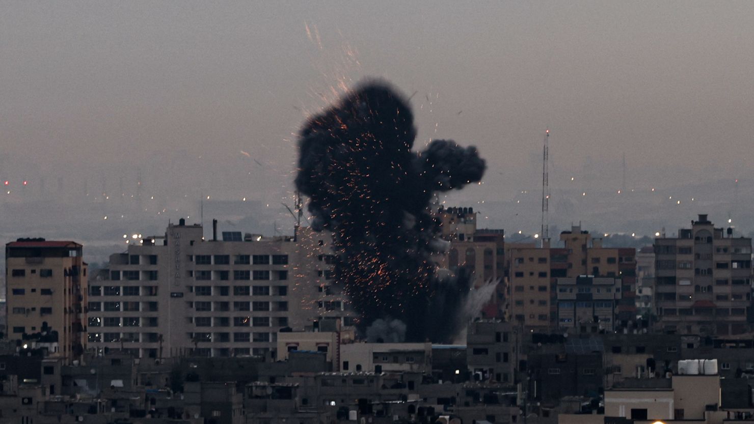 Smoke rises above buildings in Gaza as Israel launched airstrikes on February 23, 2023. 