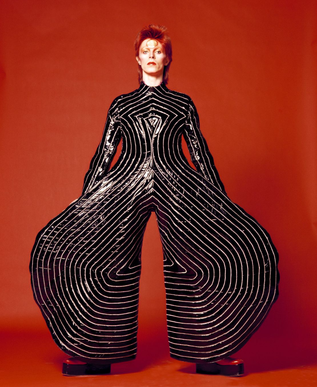 Kansai Yamamoto designed the elaborate striped bodysuit for Bowie's "Aladdin Sane" tour.
