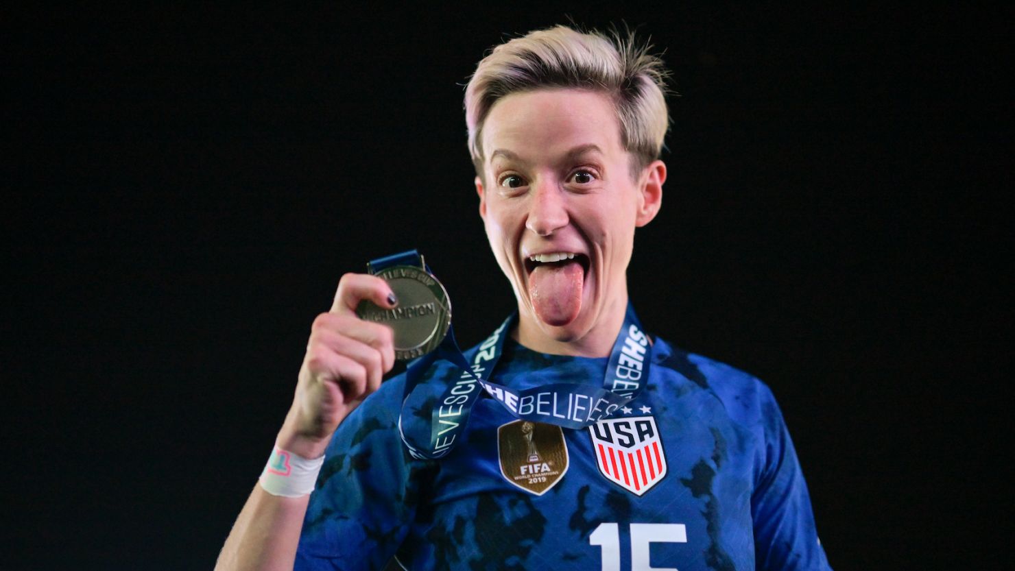 Rapinoe holds her champions' medal after winning 2023 SheBelieves Cup against Brazil.
