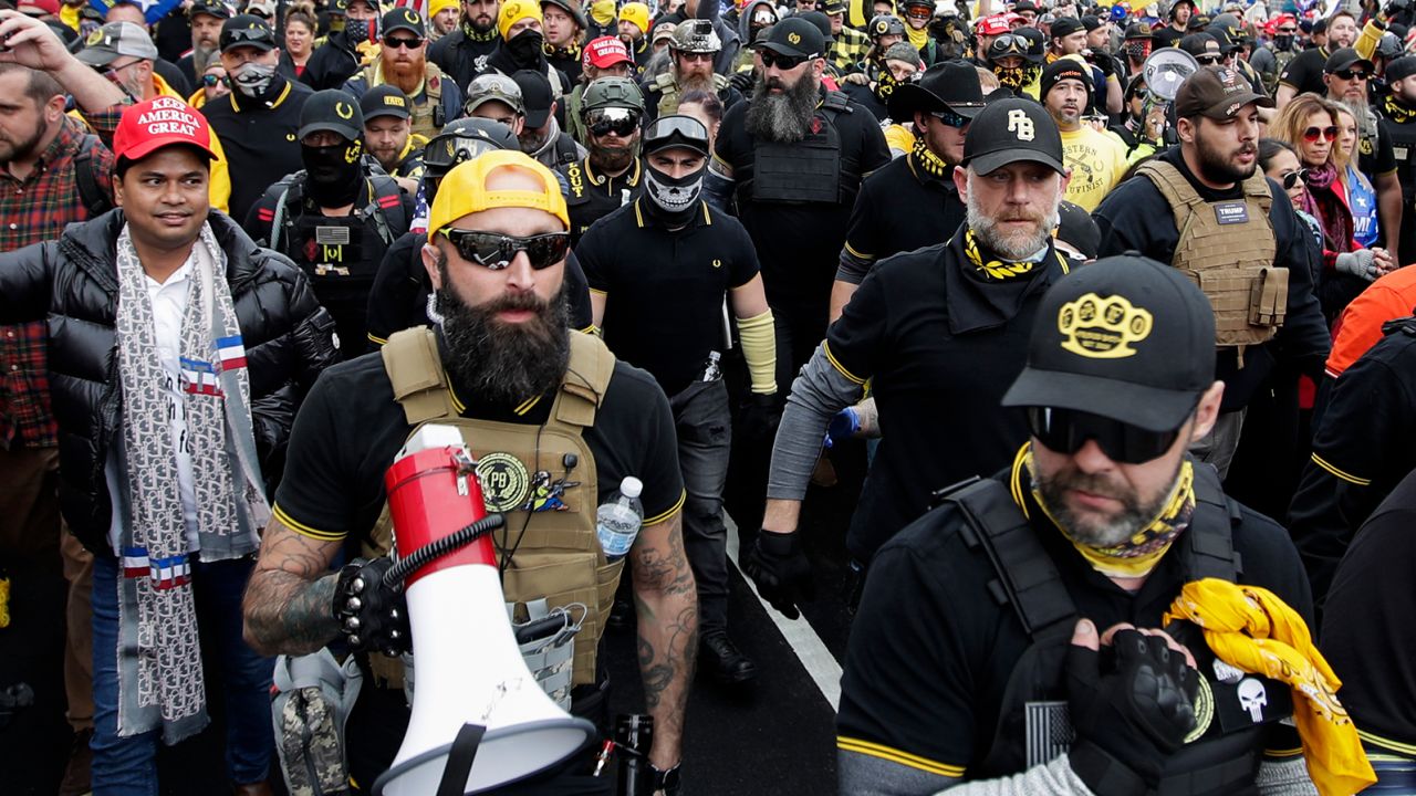 Far-right Proud Boys member Jeremy Bertino, second from left, joins other Trump supporters who are wearing attire associated with the Proud Boys as they attend a rally at Freedom Plaza, on December 12, 2020, in Washington. 
