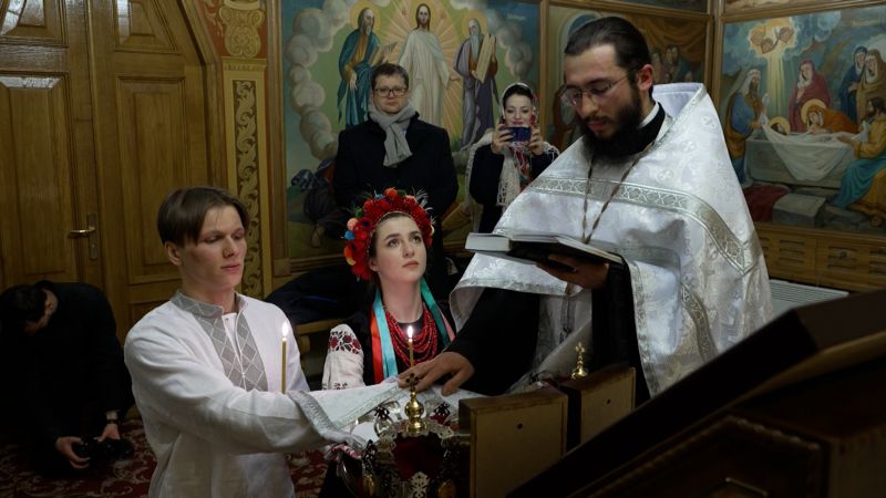 NextImg:Watch: They got married the day Russia invaded. It's been the longest year of their lives | CNN