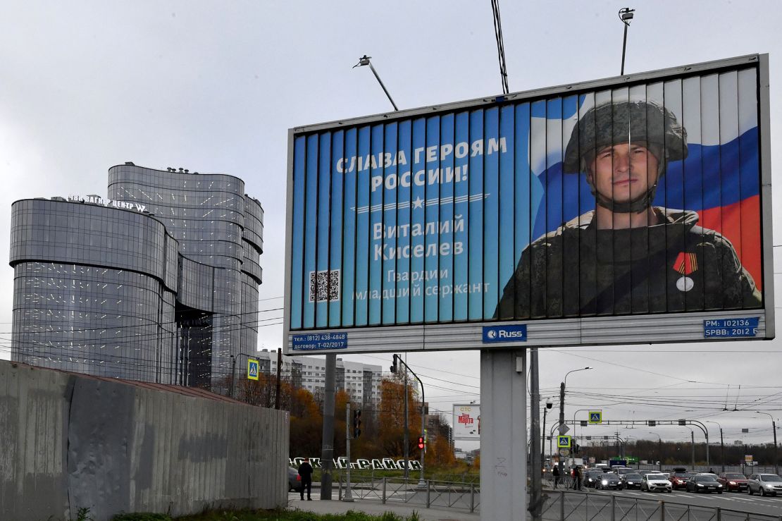 A poster displaying a Russian soldier with the slogan "Glory to the Heroes of Russia" decorates a street near the "PMC Wagner Centre" in Saint Petersburg, Russia, pictured in November 2022.