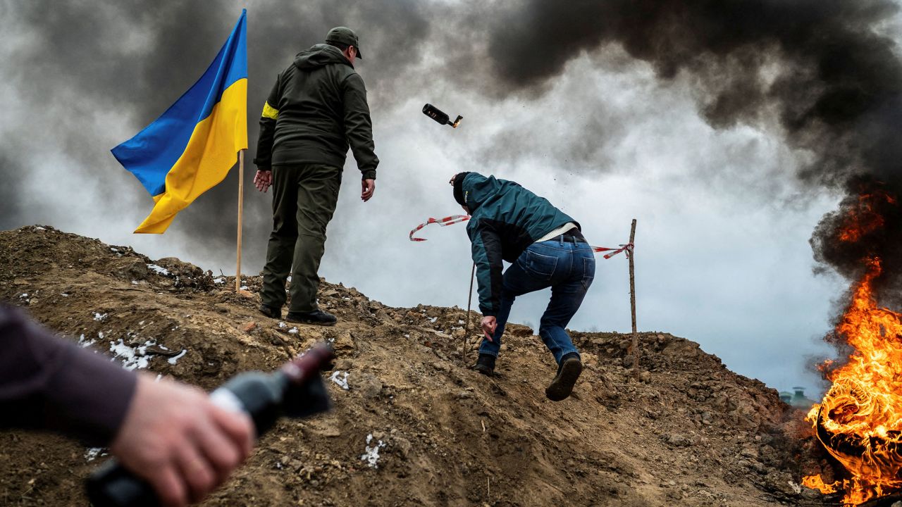 A civilian trains to throw Molotov cocktails to defend the city, as Russia's invasion of Ukraine continues, in Zhytomyr, Ukraine, on March 1, 2022.