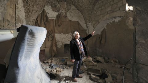 A Palestinian man, pictured on Thursday, stands inside a house that was demolished during the Israeli military raid in Nablus.