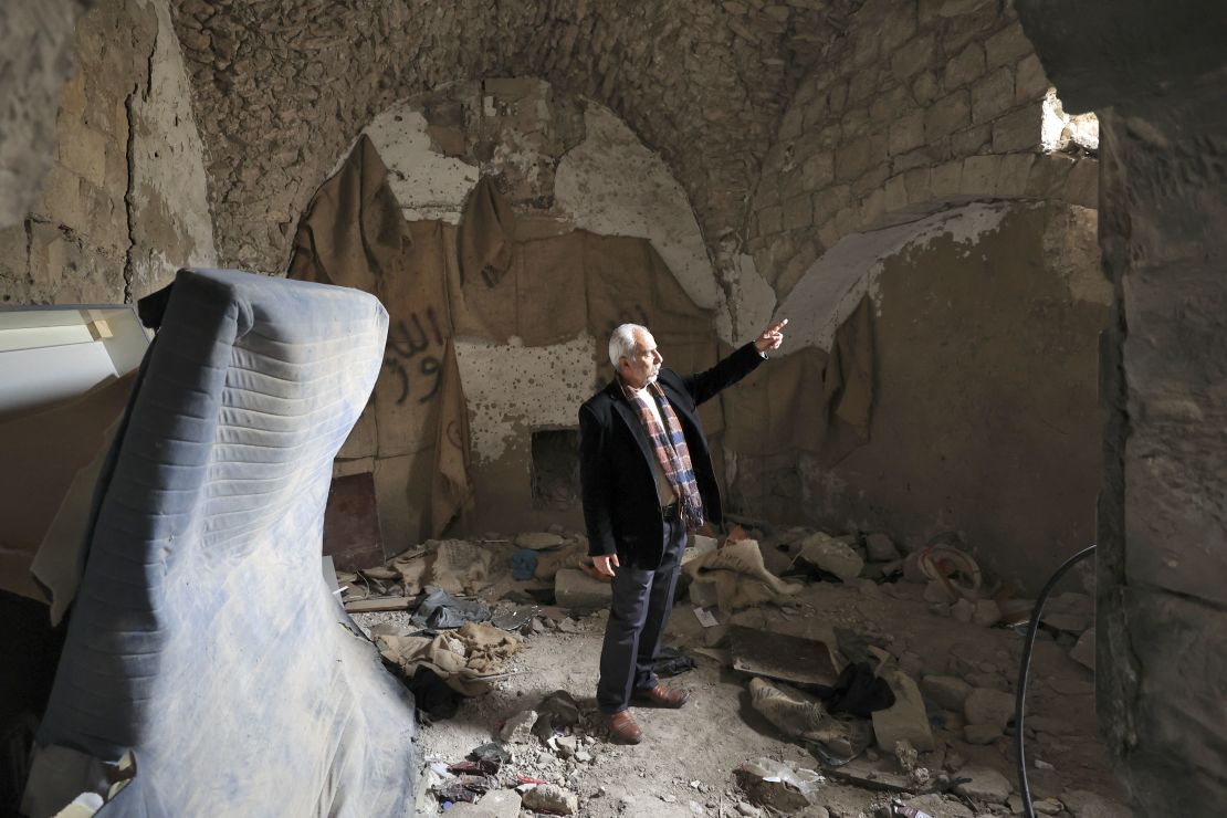 A Palestinian man, pictured on Thursday, stands inside a house that was demolished during the Israeli military raid in  Nablus.