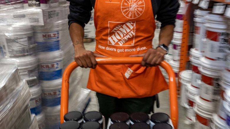 An employee pushes a cart with paint samples inside a Home Depot store in Livermore, California, US, on Thursday, May 12, 2022. Home Depot Inc. is scheduled to release earnings figures on May 17.