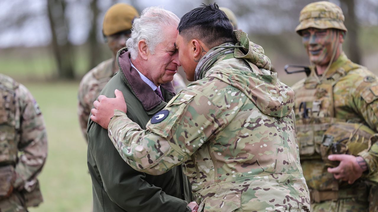 The King receives the hongi, the traditional Maori greeting, from a New Zealander who is part of the contigent training Ukrainian recruits at the site in southwest England. 