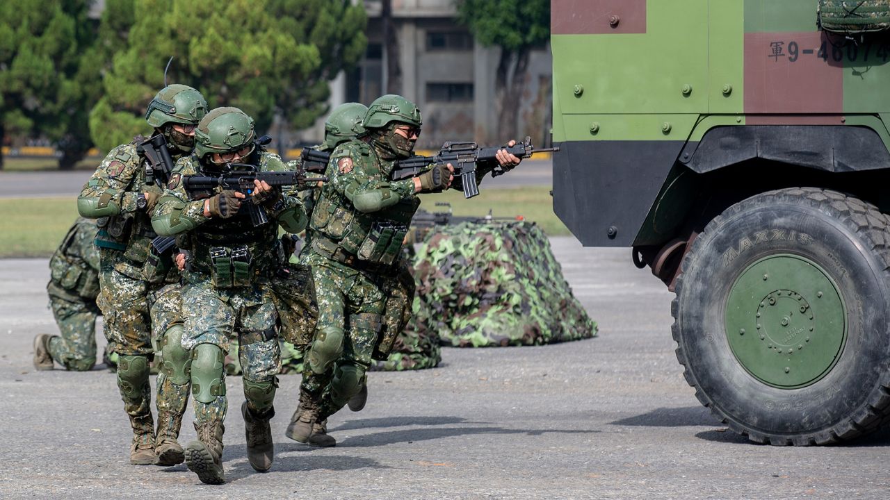 In this photo released by the Taiwan Presidential Office, soldiers take part in a drill during a visit by Taiwan's President Tsai Ing-wen, at a military base in Chiayi in southwestern Taiwan, Friday, Jan. 6, 2023. President Tsai visited a military base Friday to observe drills while rival China protested the passage of a U.S. Navy destroyer through the Taiwan Strait, as tensions between the sides showed no sign of abating in the new year. (Taiwan Presidential Office via AP)