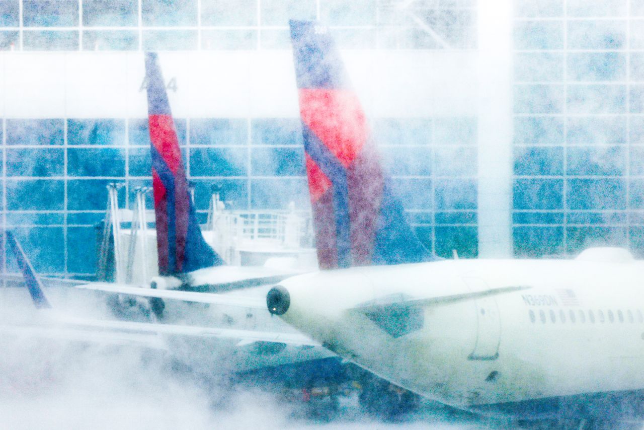 Delta jets sit at their gates at Denver International Airport during a winter storm on Wednesday, February 22. Harsh winter weather has <a href="https://www.cnn.com/travel/article/us-weather-flight-cancellations-thursday/index.html" target="_blank">disrupted thousands of US flights</a> this week.