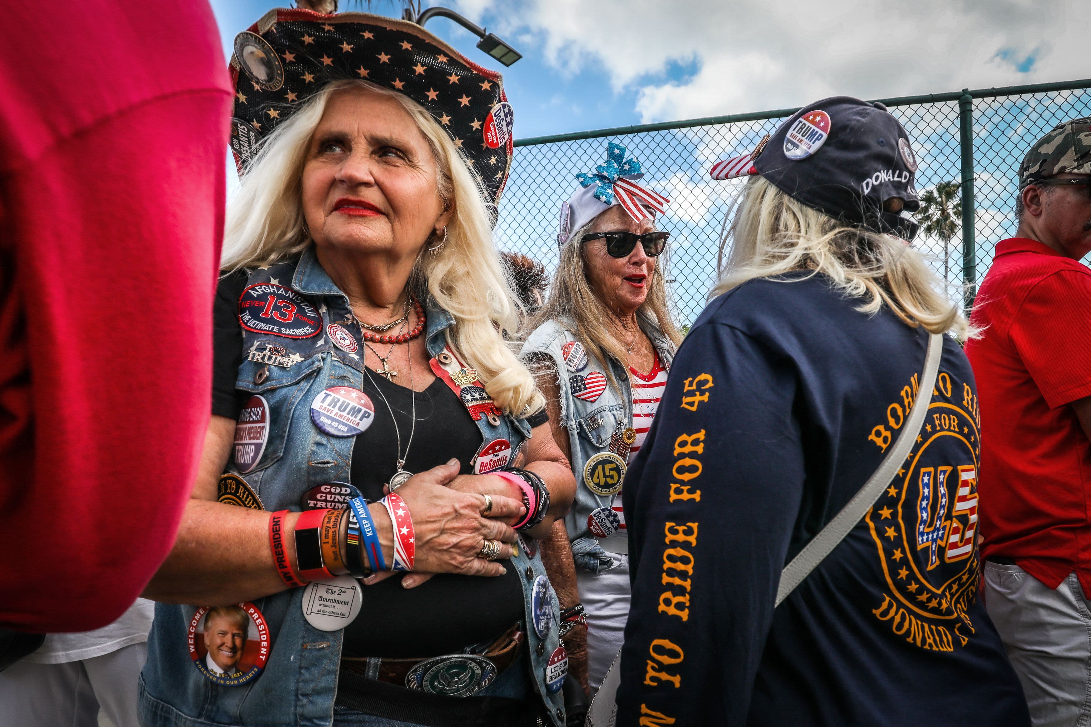 Supporters of former President Trump wait outside of an event in Florida.