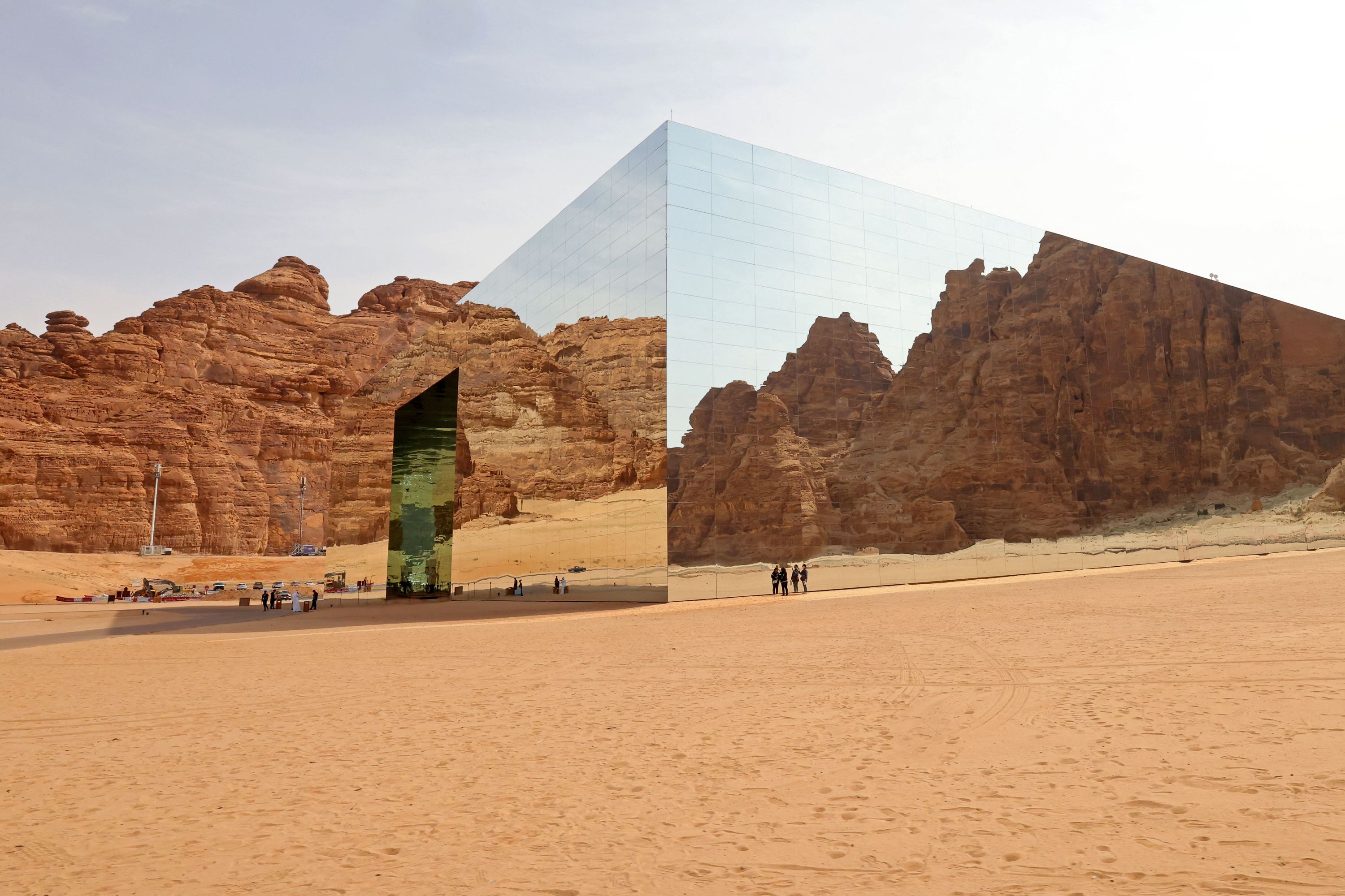 People stand outside of a concert hall in Saudi Arabia.