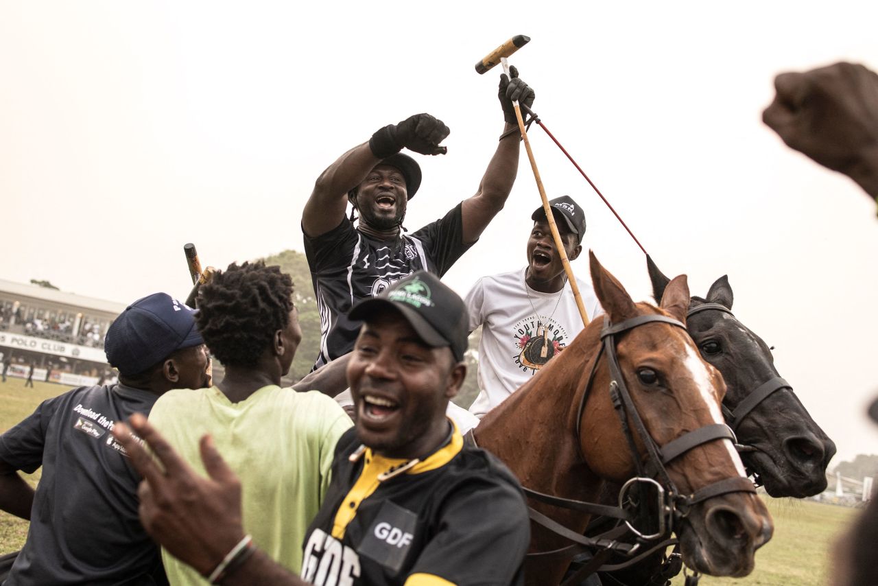 Stablemen celebrate with a player after their team won the final of the Lagos International Polo Tournament in Nigeria on Sunday, February 19.