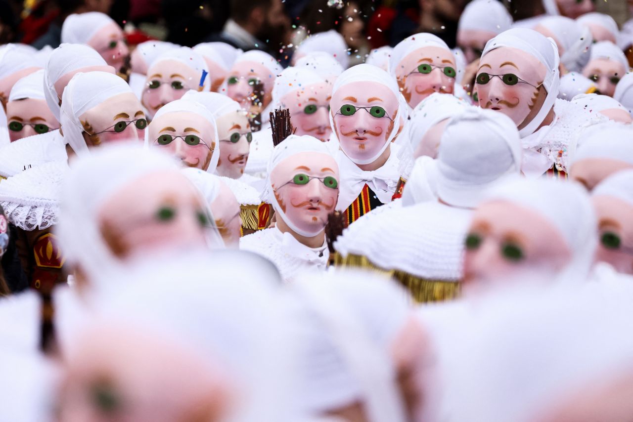 Carnival revelers take part in a parade in Binche, Belgium, on Tuesday, February 21. The costumed "Gilles" are a tradition at the Carnival of Binche.