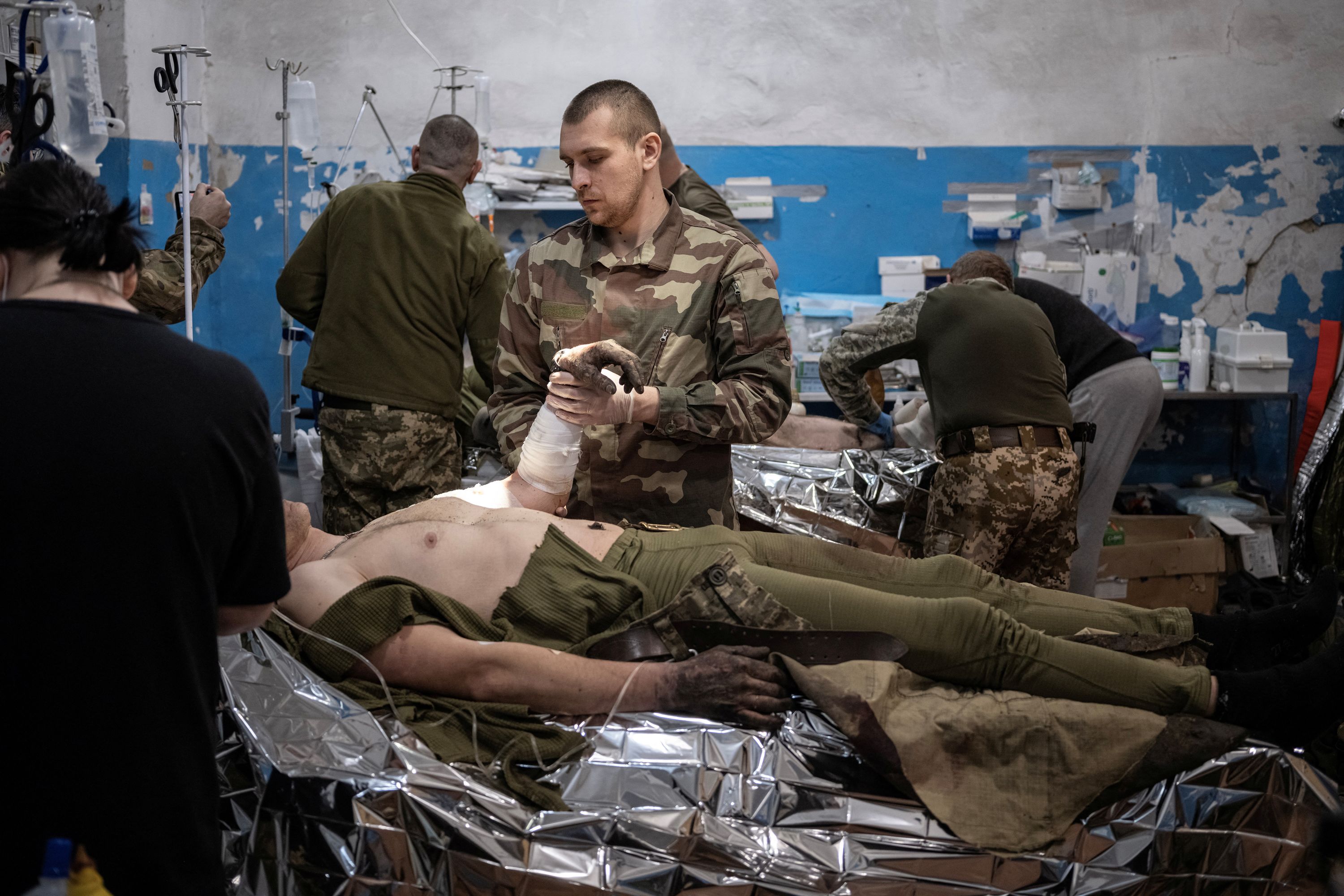 Medics treat wounded Ukrainian soldiers near Vuhledar.