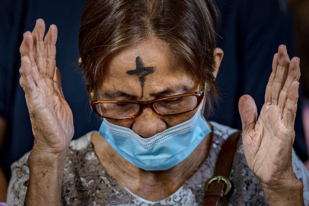 A woman prays at the Baclaran Church in Parañaque, Philippines, as she observes Ash Wednesday on February 22.