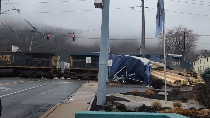 NextImg:Video shows freight train smash into truck seconds after driver got out | CNN