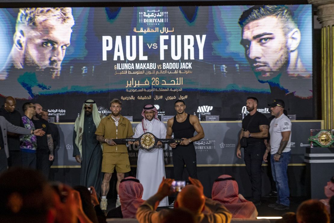 Paul and Fury hold the Diriyah Belt during their press conference.