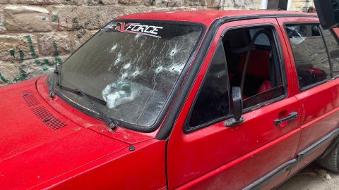 Bullet holes are seen in a car in Nablus, the day after the deadly robbery.