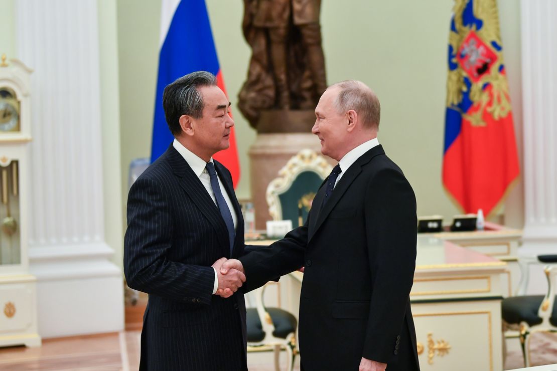 Russian President Vladimir Putin meets Wang Yi, a member of the Political Bureau of the Communist Party of China, in Moscow on Feb. 22, 2022.