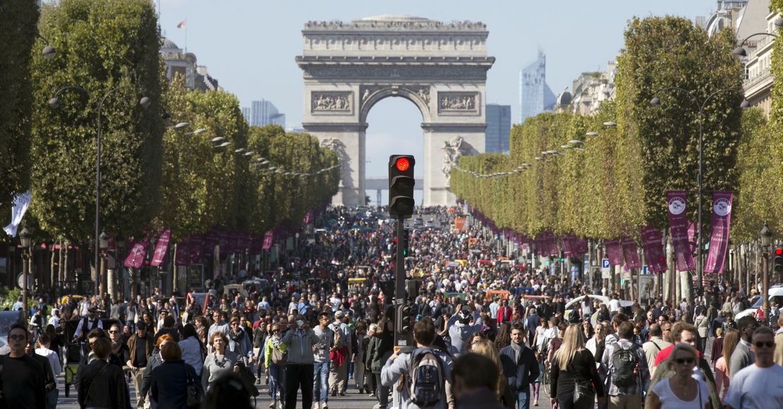 People walk on the Champs-Elysees during a car-free day central Paris.