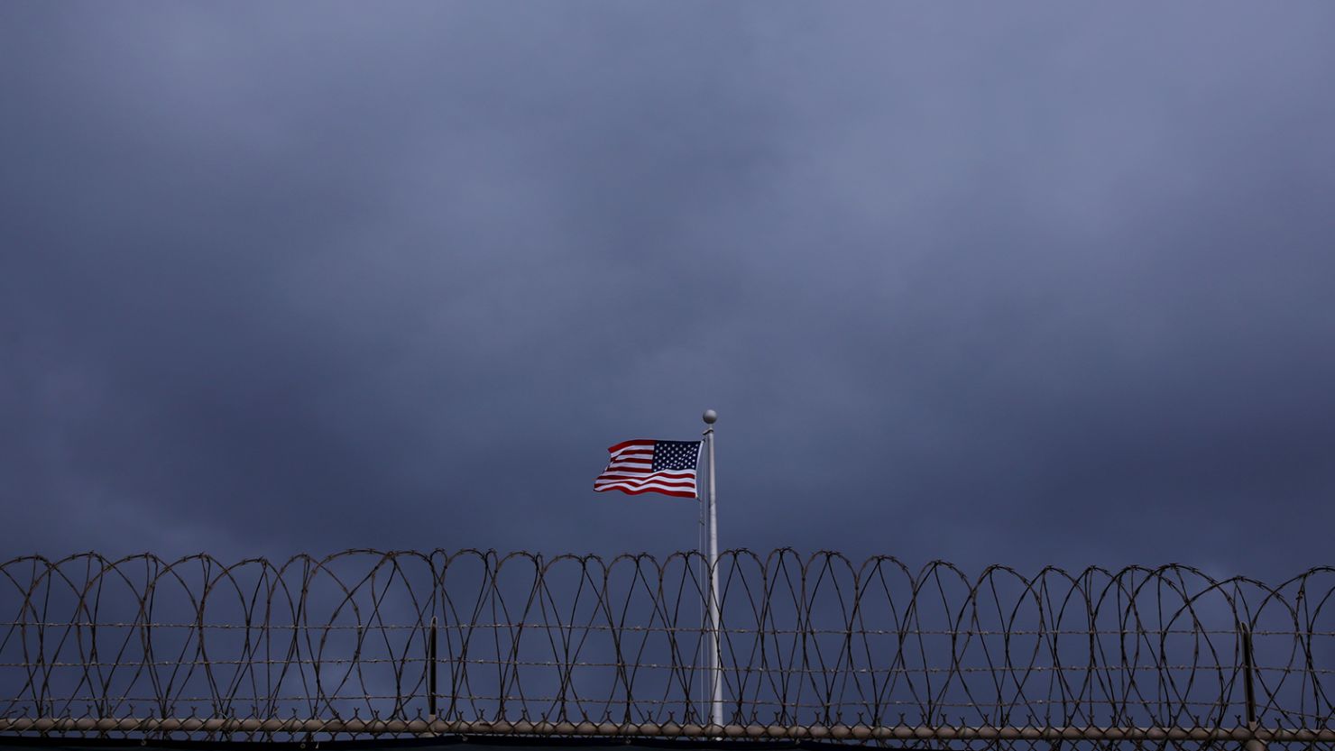 The United States flag flies inside of Joint Task Force Guantanamo Camp VI at the US Naval Base in Guantanamo Bay, Cuba, on March 22, 2016.