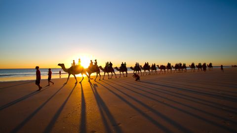 Sunset camel rides are a top draw on Cable Beach in Broome, Australia.