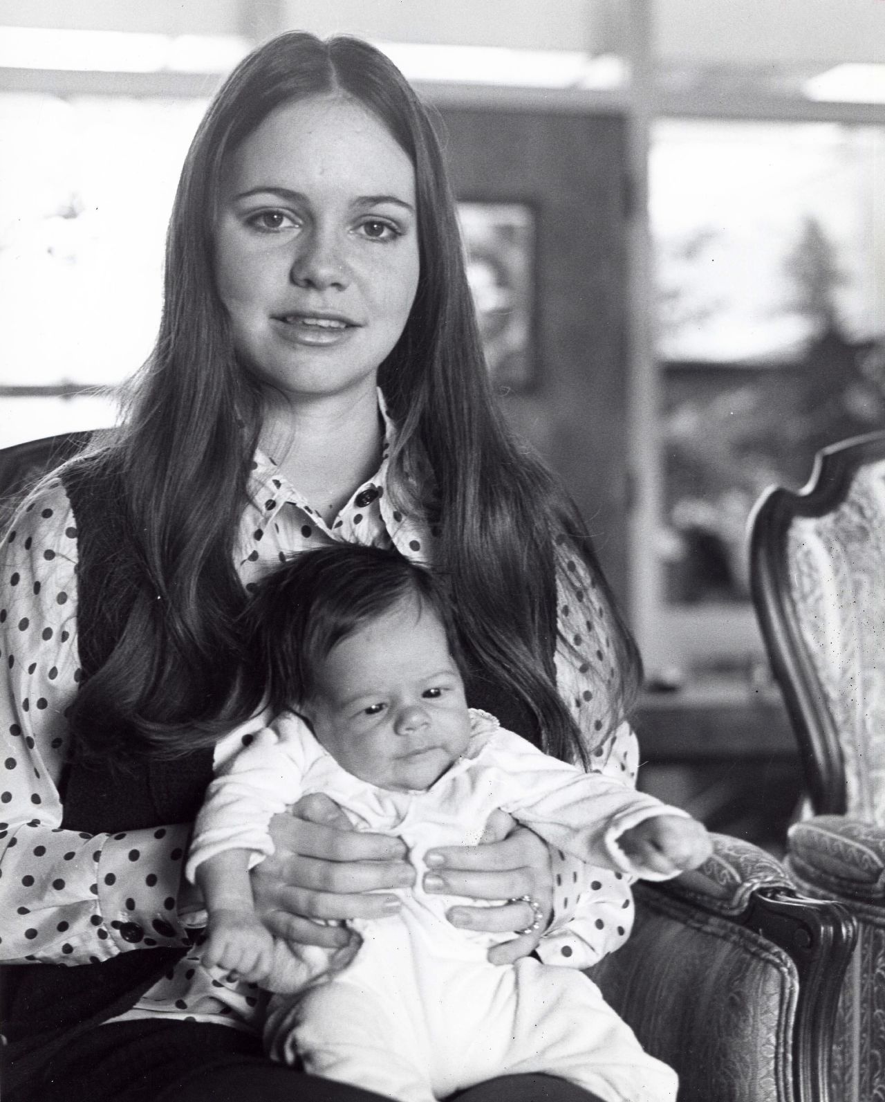 Field holds her first son, Peter Craig, in 1969.