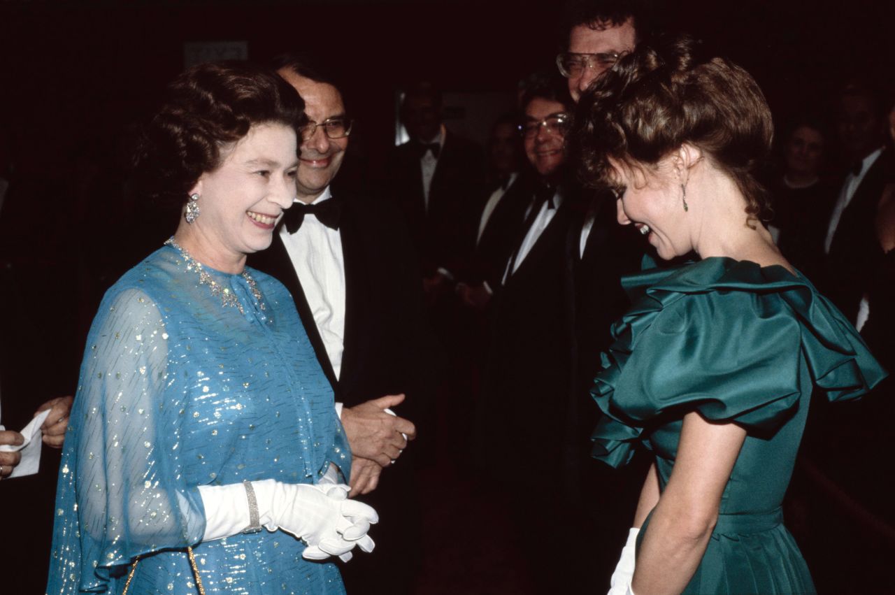 Britain's Queen Elizabeth II greets Field at the London premiere of "Absence of Malice" in 1982.