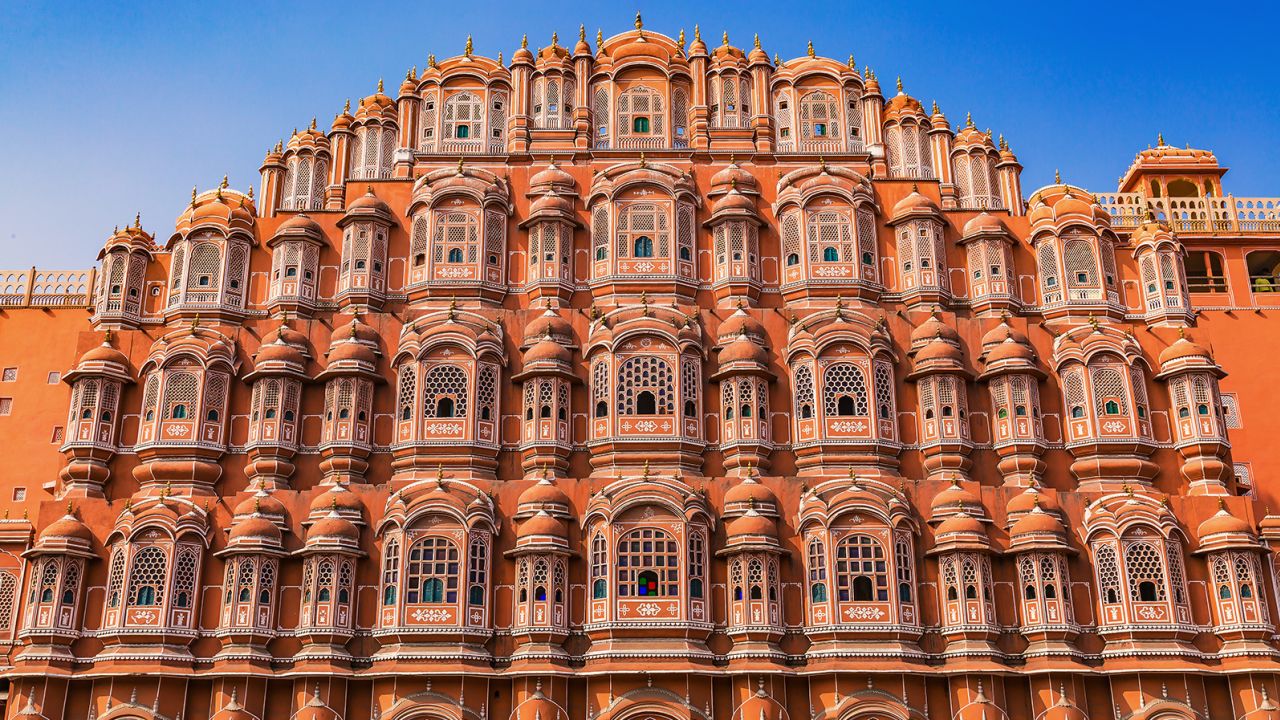 Jaipur Hawa Mahal palace made of red and pink sandstone. A primary tourist attraction in Rajasthan India.