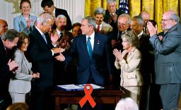 Then-President George W. Bush shakes hands with then-Sen. Joe Biden after signing an act in 2008 that reauthorized PEPFAR.