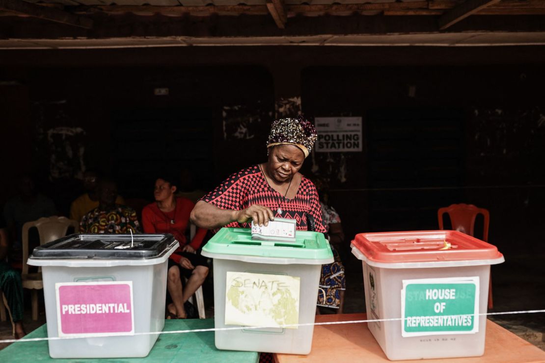 A voter casts her ballot at a polling station in Amatutu in western Anambra State on Saturday.